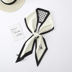 Elegant ivory silk scarf with black geometric B-pattern and stylish pointed ends
