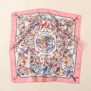 Detail of satin square scarf featuring vintage floral print and bird motifs on beige background