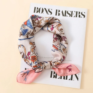 Detail of satin floral scarf with vintage bird print on a fashion magazine background