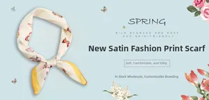 Detail of satin scarf featuring red butterfly patterns and smooth silk-like texture