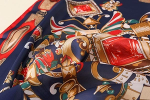 Close-up of luxury satin floral print scarf with baroque patterns and glossy texture