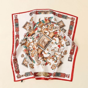 Macro shot of satin silk scarf with baroque floral patterns and red rolled edges