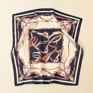 Detail of 140cm square satin scarf featuring vintage equestrian belt and chain prints