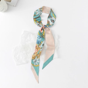 Detail of floral printed skinny silk scarf with tulip pattern and mint green accents