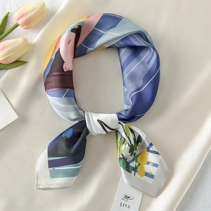 Detail of satin floral scarf with cartoon illustration and SIYA brand tag on silk fabric