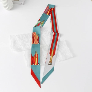 Detailed flat lay of floral skinny silk scarf with equestrian horse bit pattern print