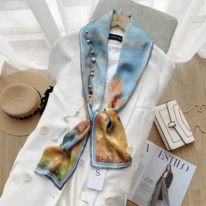 Elegant impressionist oil painting silk scarf styled with white suit and pearl necklace