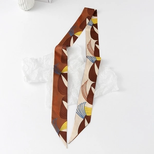 Detail of floral silk scarf showing abstract leaf patterns and vintage color textures