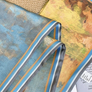 Detailed macro view of artist oil painting pattern on silk feeling polyester scarf