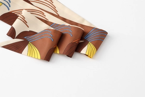 Macro shot showing detail of floral twilly scarf fabric and abstract pattern texture