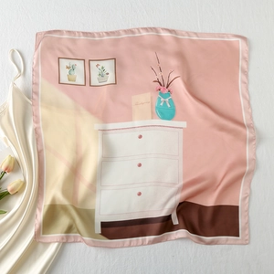 Detail of pink satin scarf showing Thanksgiving illustration and fine edge stitching