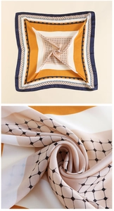 Dettaglio del motivo geometrico e della trama satinata liscia sul foulard quadrato di seta