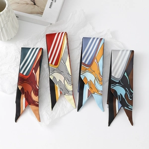 Detail showing four silk-like skinny scarves with elegant floral and horse patterns