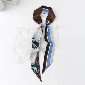 Detailed flat lay of a floral print satin skinny scarf with equestrian patterns on paper