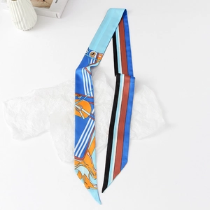 Macro detail of equestrian silk scarf with horse head pattern on wrinkled paper
