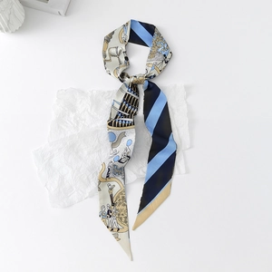 Detail of a floral twilly silk scarf featuring artistic illustrations and blue twill patterns