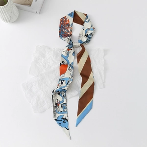 Close-up of floral skinny silk scarf with double-sided art print and striped pattern