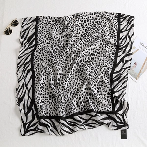 Detail of thin leopard and zebra print scarf used as a versatile summer shawl
