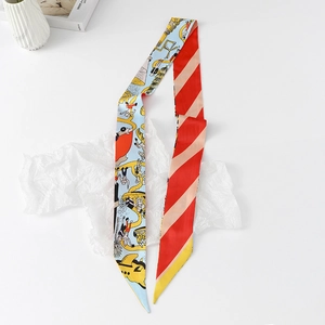 Detail of a double-sided Twilly scarf with cartoon illustrations and striped silk patterns
