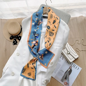 Elegant digital ink painting silk scarf with pearl accents on white suit and straw hat