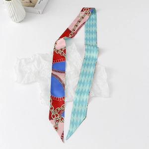 Macro detail of silk-like twilly scarf with golden chain pattern and argyle print