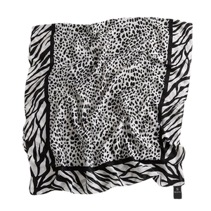 Lightweight leopard and zebra print cotton-linen scarf with elegant draped textures