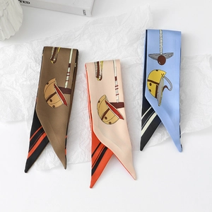 Detailed view of three polo-themed silk twilly scarves with mallet and helmet print