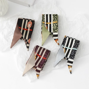 Set of four floral skinny silk scarves in brown, green, red and blue with retro patterns