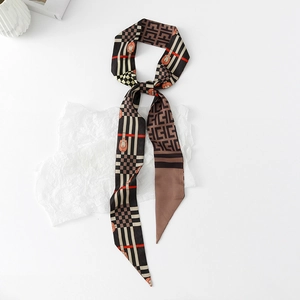 Close-up of narrow twilly silk scarf with retro horsebit and checkerboard patterns