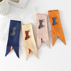 Close-up of narrow twilly silk scarves with horse prints in navy, beige, pink and orange