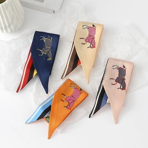 Detail of four narrow floral silk scarves with horse patterns and geometric border