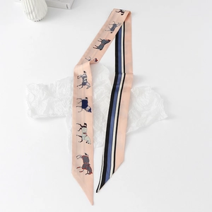 Detailed close-up of double-sided twilly scarf featuring floral horse and striped pattern