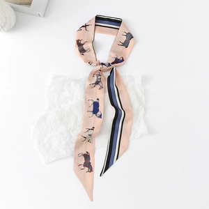 Detail of floral horse print silk neck scarf showing sleek stripe edge and pointed ends