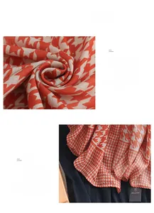 Detail of soft houndstooth scarf fabric in orange and beige weave with beauty tag
