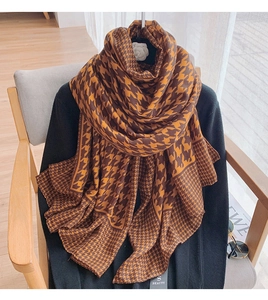 Close-up of warm brown houndstooth pattern fabric on thick cotton linen scarf