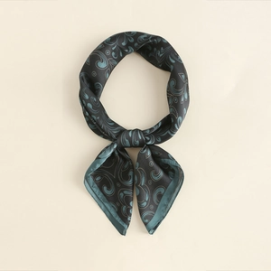 Detail of silk-like paisley square scarf with vintage gold border and smooth texture