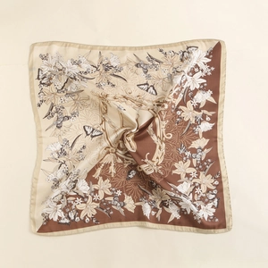 Detail of vintage square silk scarf with floral butterfly prints and gold-toned edges