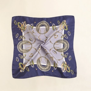 Detailed view of the vintage square silk scarf featuring golden equestrian horse patterns