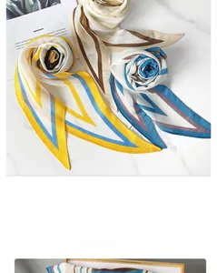 Close-up of diamond cut geometric striped silk scarves on marble background decor