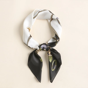Detailed shot of retro silk square scarf with gold chain pattern and elegant bow knot