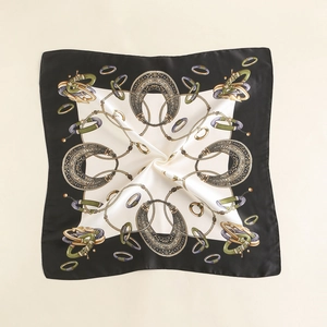 Close-up of vintage equestrian satin scarf with horseshoe and chain patterns