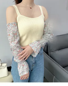 Detailed view of floral chiffon sun protection sleeves with ruffled elastic cuffs