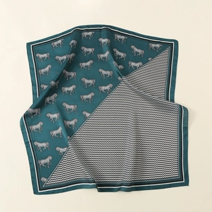 Detailed pattern of a square silk scarf with zebra print horse design and gilded edges