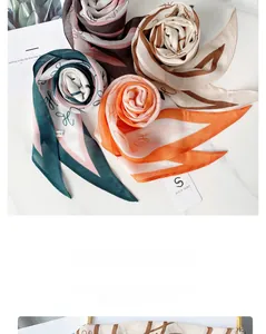 Macro detail of diamond silk scarves with H pattern on marble background