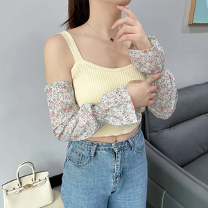 Detailed view of floral flare sun sleeves paired with a ribbed knit camisole and jeans