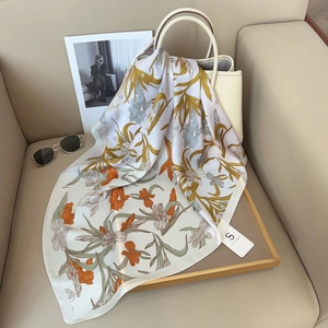 Elegant floral print silk square scarf featuring iris patterns and sophisticated colors