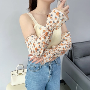 Detail of floral chiffon cooling arm sleeves with ruffled elastic cuffs and rose print