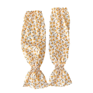 Floral chiffon sun protection sleeves with yellow daisy prints and elastic ruffled cuffs