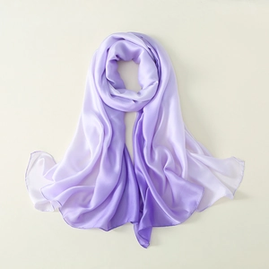 Detailed close-up showing the gradient purple silk satin texture and soft sheen of the scarf