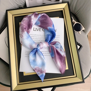 Blue and purple tie-dye silk-feel scarf displayed in a stylish frame with sunglasses